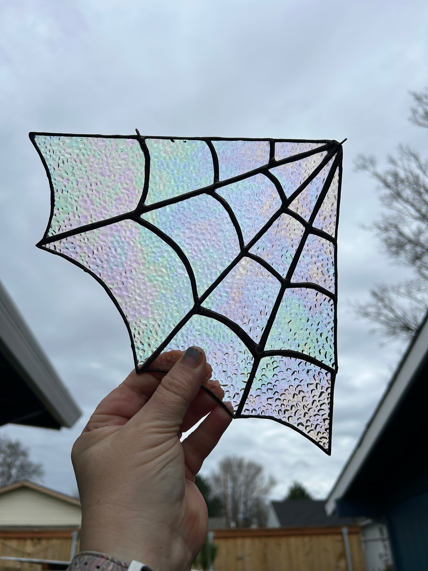 Iridescent stained glass spider web corner