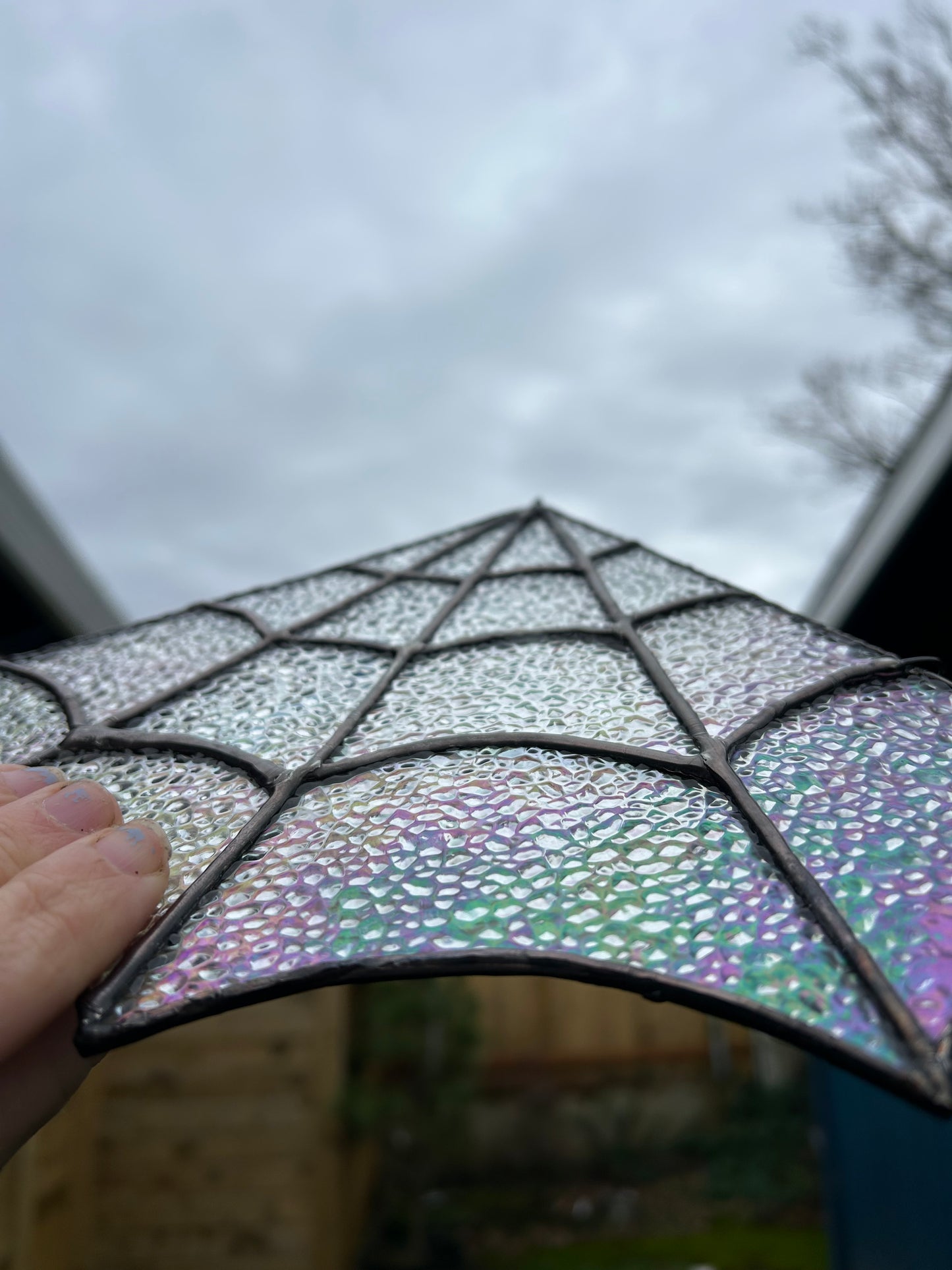 Iridescent stained glass spider web corner