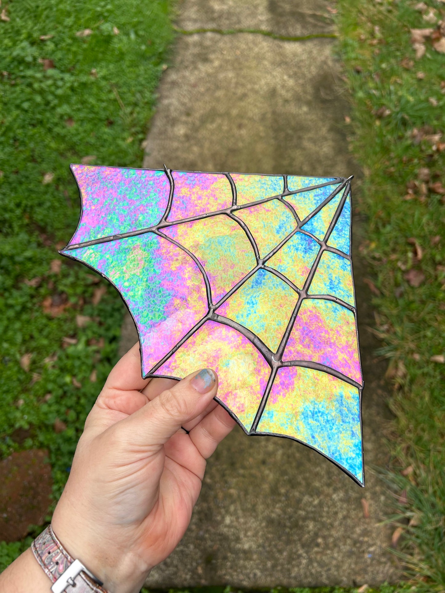 Iridescent stained glass spider web corner